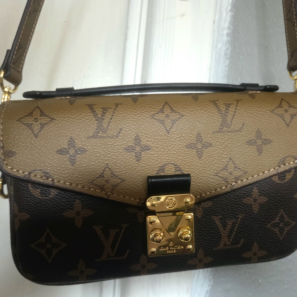 Louis Vuitton Pochette Métis East West Reverse Monogram Canvas